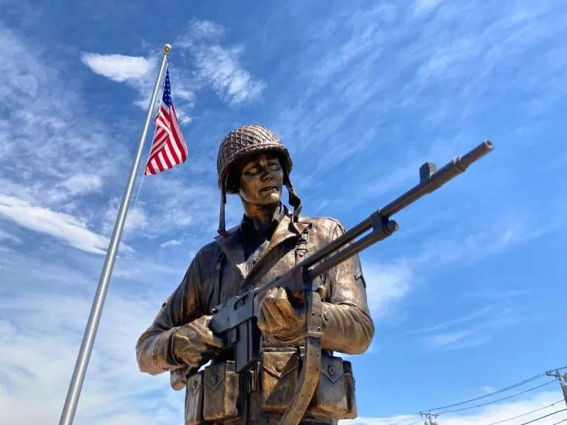 Bronze statue honoring Charles N. DeGlopper at the memorial